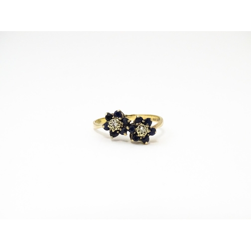 642 - A 9ct gold ring set with diamonds and spinel. Ring size approx. L