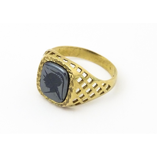 644 - A 9ct gold gentleman's intaglio ring set. Ring size approx. T 1/2