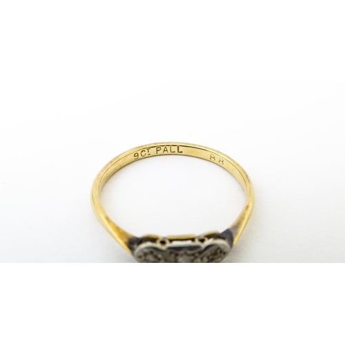 645 - A 9ct gold ring with palladium set diamonds to top in an Art deco setting. Ring size approx. O