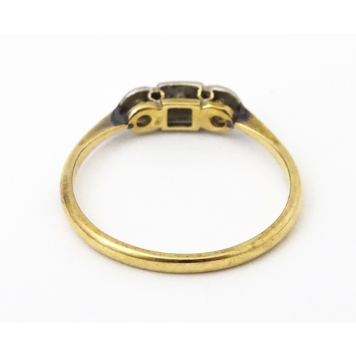 645 - A 9ct gold ring with palladium set diamonds to top in an Art deco setting. Ring size approx. O