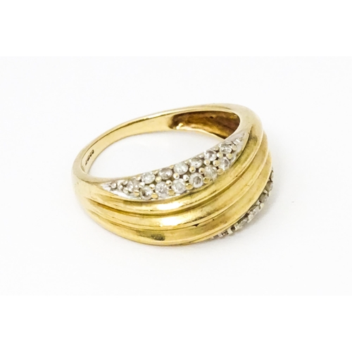 656 - A 9ct gold ring set with diamonds, Ring size approx. M 1/2