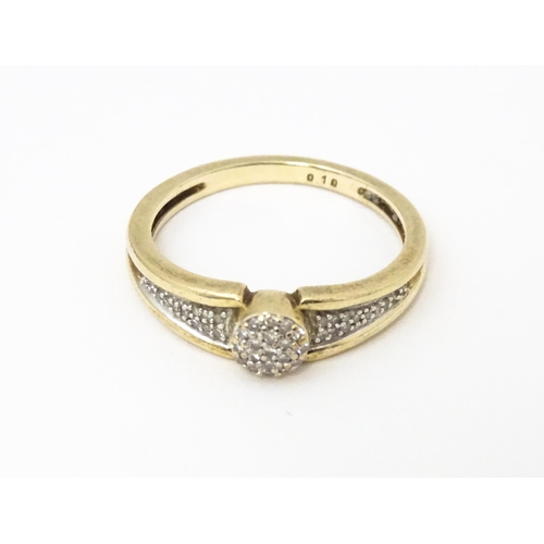 657 - A 9ct gold ring set with diamonds. Ring size approx. M 1/2