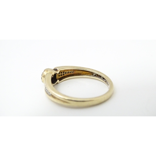 657 - A 9ct gold ring set with diamonds. Ring size approx. M 1/2