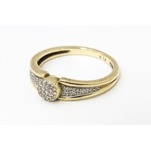 657 - A 9ct gold ring set with diamonds. Ring size approx. M 1/2