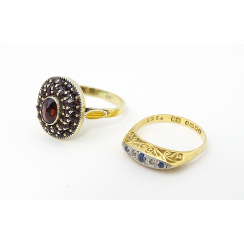 662 - An 18ct gold ring set with diamonds and sapphires together with a Continental silver gilt ring set w... 