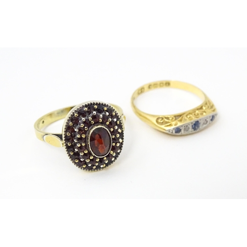 662 - An 18ct gold ring set with diamonds and sapphires together with a Continental silver gilt ring set w... 