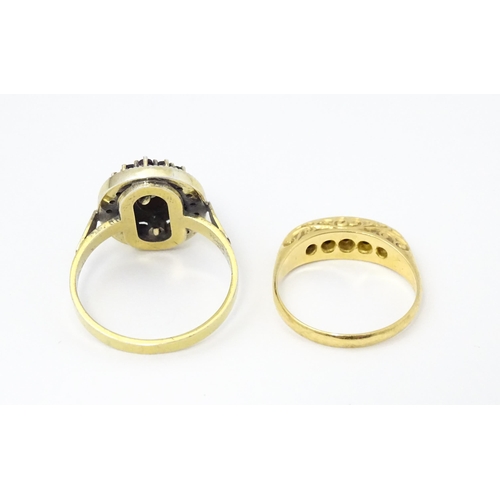 662 - An 18ct gold ring set with diamonds and sapphires together with a Continental silver gilt ring set w... 