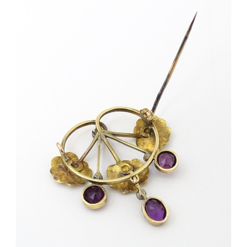 675 - A Continental Art Nouveau  gold brooch set with amethyst and diamonds. Approx 1 1/4