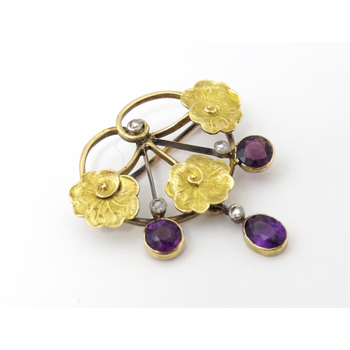 675 - A Continental Art Nouveau  gold brooch set with amethyst and diamonds. Approx 1 1/4