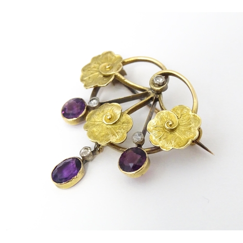 675 - A Continental Art Nouveau  gold brooch set with amethyst and diamonds. Approx 1 1/4