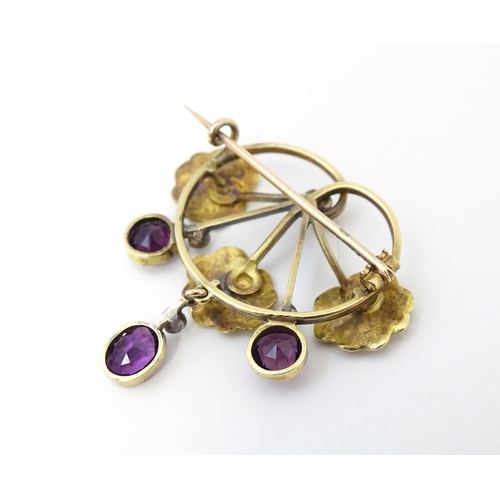 675 - A Continental Art Nouveau  gold brooch set with amethyst and diamonds. Approx 1 1/4