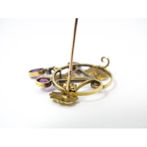 675 - A Continental Art Nouveau  gold brooch set with amethyst and diamonds. Approx 1 1/4