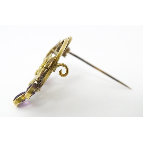 675 - A Continental Art Nouveau  gold brooch set with amethyst and diamonds. Approx 1 1/4