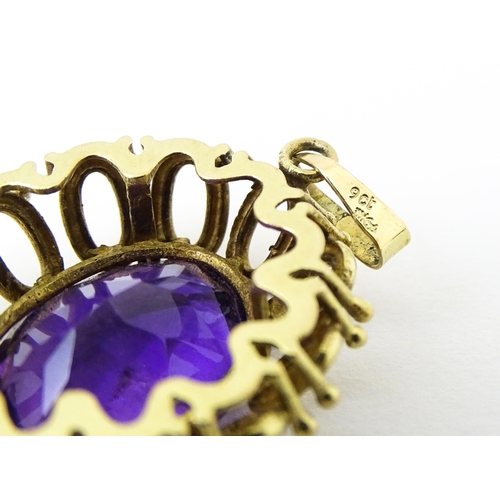 680 - A 9ct gold pendant set with central amethyst. Approx 1 1/2