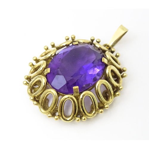 680 - A 9ct gold pendant set with central amethyst. Approx 1 1/2