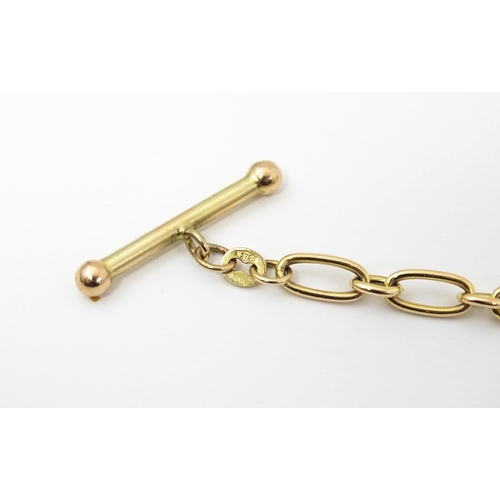 683 - A 9ct gold and yellow metal bracelet.