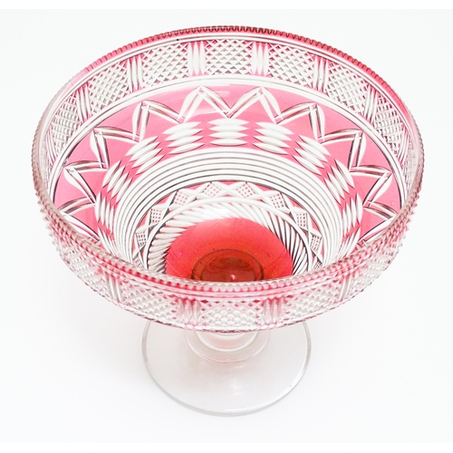 259 - A 19thC cut glass /  crystal pedestal bowl with cranberry flash detail. Approx 9 1/2