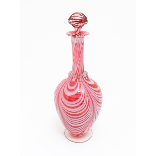 260 - A Victorian cranberry and white glass Nailsea style decanter and stopper, with clear glass foot. App... 