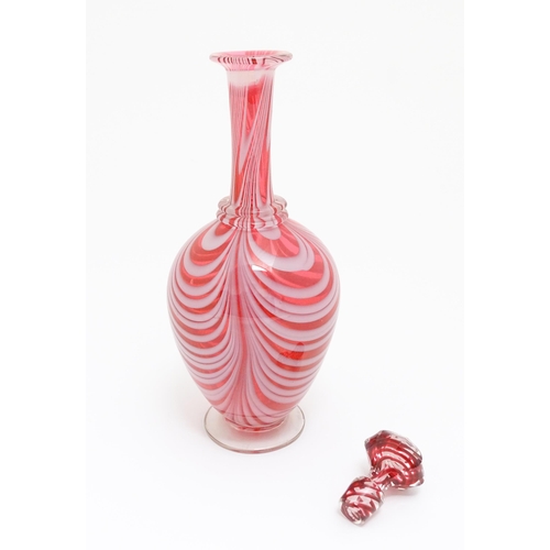 260 - A Victorian cranberry and white glass Nailsea style decanter and stopper, with clear glass foot. App... 