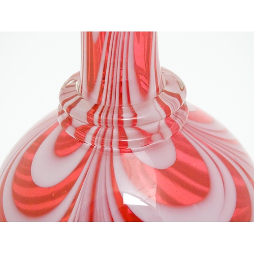 260 - A Victorian cranberry and white glass Nailsea style decanter and stopper, with clear glass foot. App... 