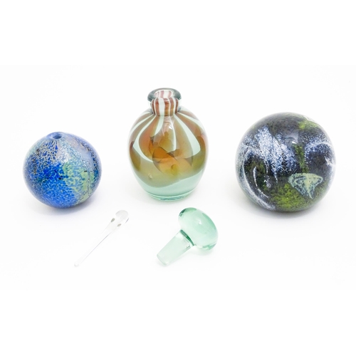 277 - Three items of art glass comprising a Mdina glass paperweight, a scent / perfume bottle and stopper ... 