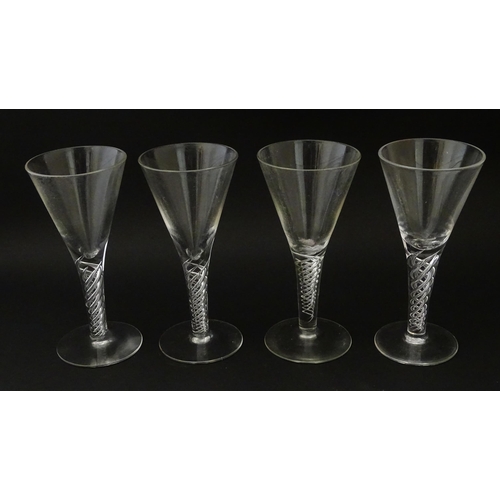 281 - Four late 20thC drinking gasses with air twist detail to stems (4)