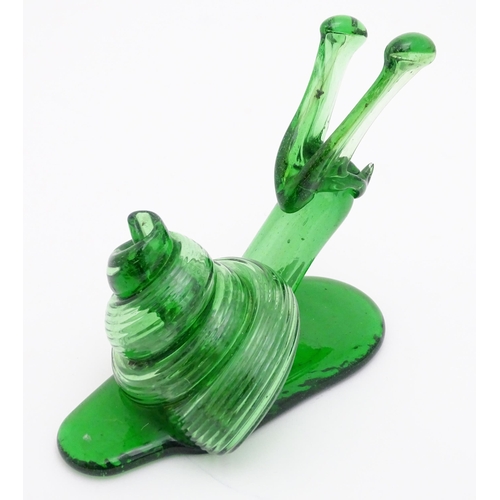 283 - A green glass model of a snail. Approx. 5 3/4