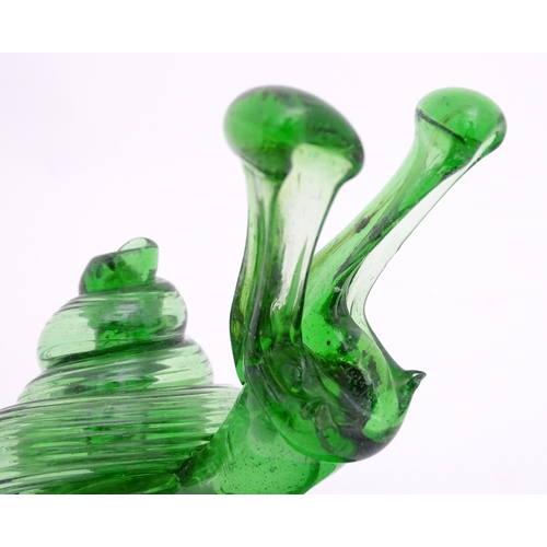 283 - A green glass model of a snail. Approx. 5 3/4