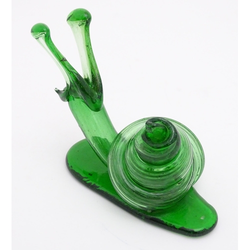 283 - A green glass model of a snail. Approx. 5 3/4