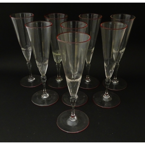 287 - Salviati & Co. Glassware: Eight Venetian glass champagne flutes with pink detail to rims. Approx. 8