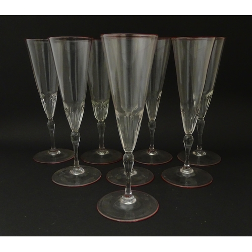 287 - Salviati & Co. Glassware: Eight Venetian glass champagne flutes with pink detail to rims. Approx. 8