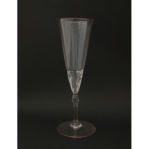 287 - Salviati & Co. Glassware: Eight Venetian glass champagne flutes with pink detail to rims. Approx. 8