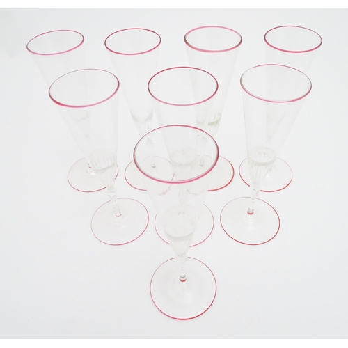 287 - Salviati & Co. Glassware: Eight Venetian glass champagne flutes with pink detail to rims. Approx. 8