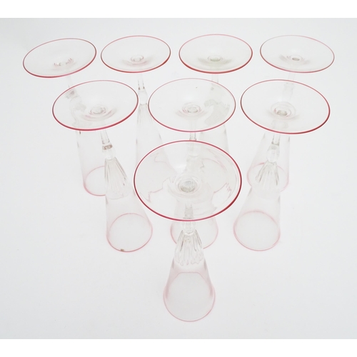 287 - Salviati & Co. Glassware: Eight Venetian glass champagne flutes with pink detail to rims. Approx. 8