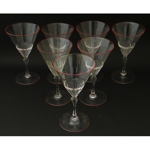 290 - Salviati & Co. Glassware: Seven Venetian glass pedestal drinking glasses with pink detail to rims. A... 