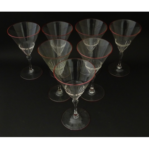 290 - Salviati & Co. Glassware: Seven Venetian glass pedestal drinking glasses with pink detail to rims. A... 