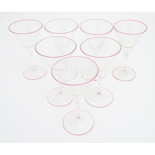 290 - Salviati & Co. Glassware: Seven Venetian glass pedestal drinking glasses with pink detail to rims. A... 