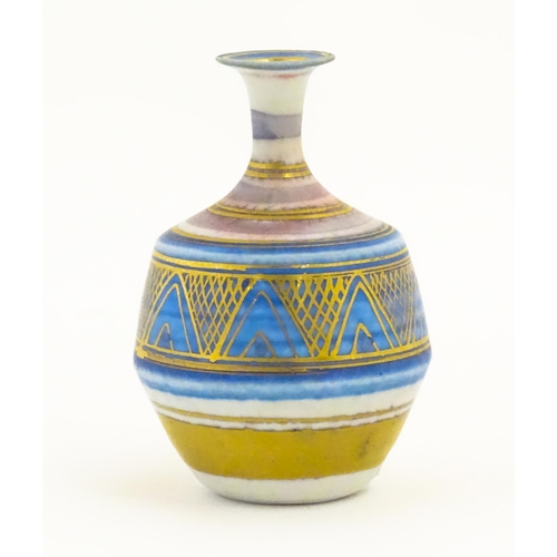 100 - A small studio pottery vase by Mary Rich with banded and geometric detail. Impressed mark lower. App... 