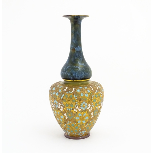 103 - A Doulton Lambeth ovoid vase with mottled blue glaze to neck and lace work floral detail to body. Im... 