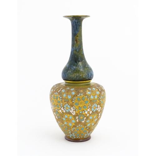 103 - A Doulton Lambeth ovoid vase with mottled blue glaze to neck and lace work floral detail to body. Im... 