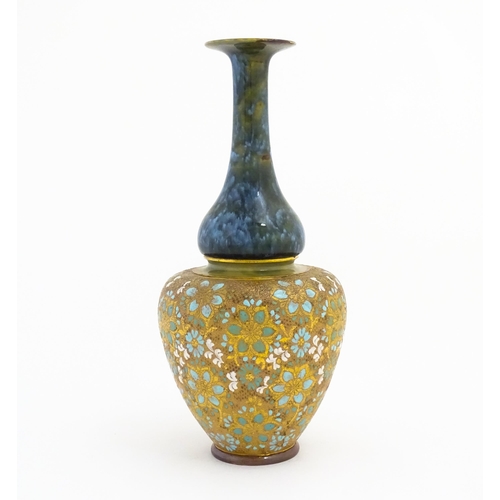 103 - A Doulton Lambeth ovoid vase with mottled blue glaze to neck and lace work floral detail to body. Im... 