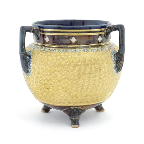 104 - A Royal Doulton stoneware gilt circle tyg of cauldron form with three mottled blue handles, banded d... 