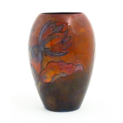 108A - A Moorcroft pottery flambe vase of tapering ovoid form decorated in the Dahlia pattern. Impressed an... 