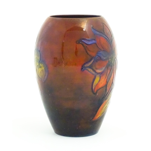 108A - A Moorcroft pottery flambe vase of tapering ovoid form decorated in the Dahlia pattern. Impressed an... 