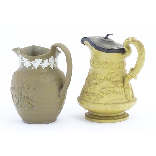 110 - A Ridgway & Co. jug with a hinged pewter lid, the body decorated in relief in the Tam O'Shanter patt... 