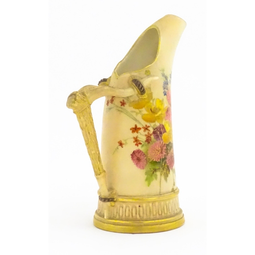 114 - A Royal Worcester blush ivory jug, the body decorated with floral sprays, the handle modelled as an ... 