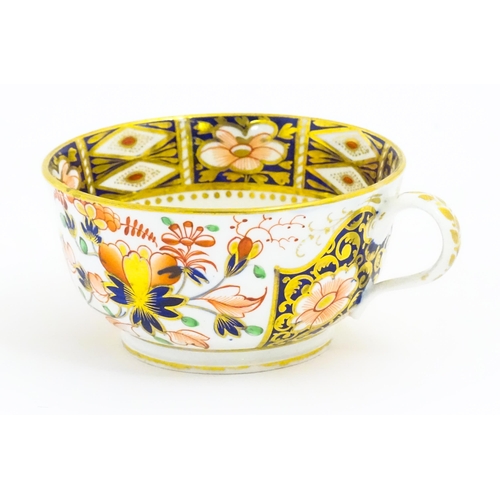 118 - A Derby porcelain tea cup and saucer decorated in the Imari pattern. Marked under. Saucer approx. Cu... 