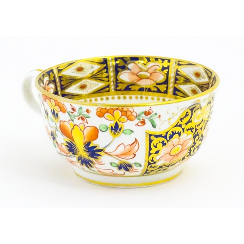 118 - A Derby porcelain tea cup and saucer decorated in the Imari pattern. Marked under. Saucer approx. Cu... 