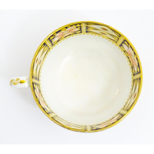 118 - A Derby porcelain tea cup and saucer decorated in the Imari pattern. Marked under. Saucer approx. Cu... 