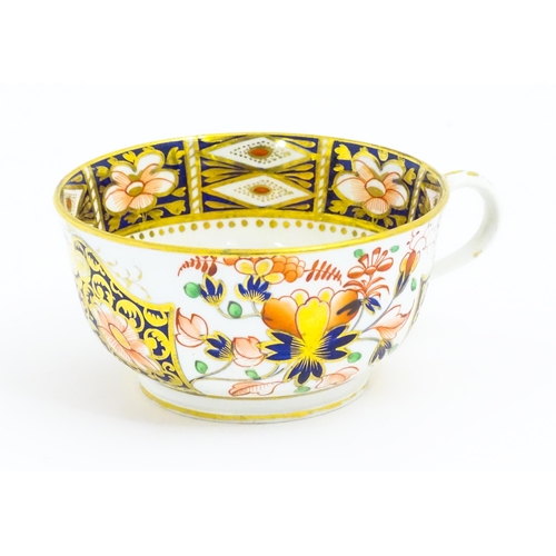 118 - A Derby porcelain tea cup and saucer decorated in the Imari pattern. Marked under. Saucer approx. Cu... 